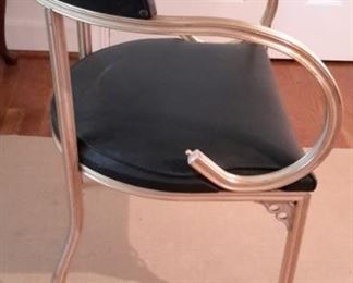 Mid Century Modern chair, with black vinyl seat back and seat. No tears or scratches, in excellent condition.