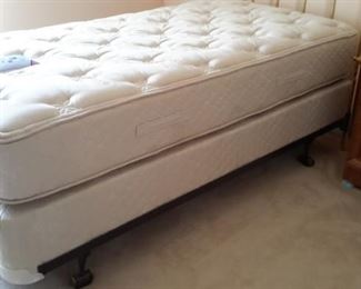 Two sets of twin brass head boards, mattresses, box springs and rails. All in like-new condition.