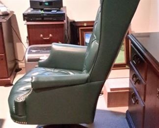 Large Ethan Allen Wing Back green leather tufted swivel office chair with nail head trim, in excellent condition.