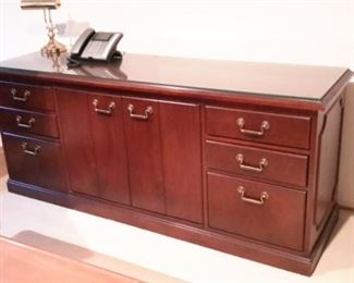 Credenza cabinet with 2 drawers, 2 file drawers and storage center.