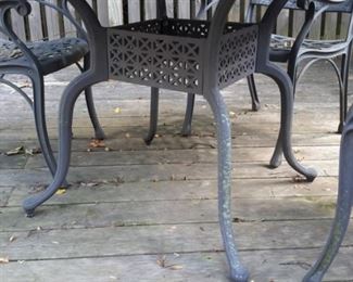 Cast aluminum patio table and 4 chairs.