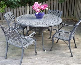 Cast aluminum patio table and 4 chairs.
