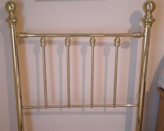 Two sets of twin brass head boards, mattresses, box springs and rails. All in like-new condition.