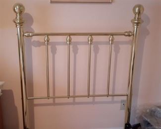 Two sets of twin brass head boards, mattresses, box springs and rails. All in like-new condition.