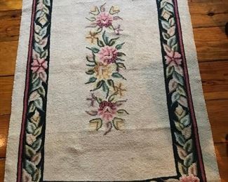 One of a pair of hand-made needlepoint rugs