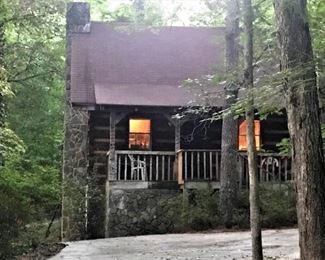 Well-crafted cabin on heavily wooded lot: 1 Bed, 1 Bath, Fireplace, Front & Back decks, 1950s railroad car wooden floors, circular staircase w/brass rail, jacuzzi tub on marble floors. Basement w/4 put-put holes. Two fenced tennis courts (clay & grass) in need of reclaiming if desired.