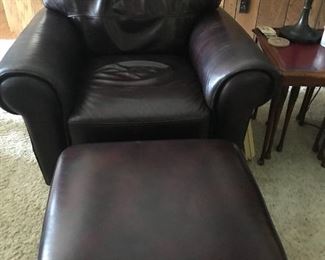 Matching leather chairs and ottomans