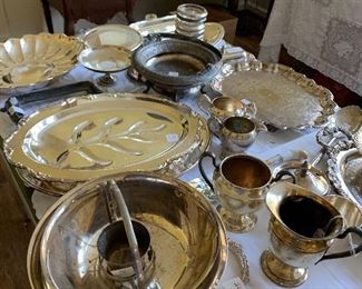 Lots of lovely silver serving pieces...trays, bowls, dishes, picture frame, nose gay, teapots and more!!