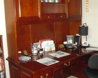 This is a Winner's Only L-shaped desk.  Has a few knicks but is solid wood.  If you have the space, you can't go wrong with this 60" piece.