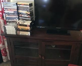 FLAT SCREEN TV AND LOTS OF DVDs.
