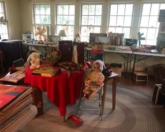 Room at top of stairs full of toys, records, record player and more