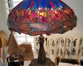 This one is one of the good Tiffany style lamps....Super heavy and large and mint condition! When it is lit up there is a gorgeous PINKISH hue everywhere! STUNNING!