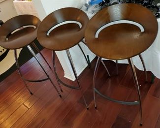 OK...These are extraordinary bar stools! Wood seat, rubber foot rest and chrome mid cen-contem vibe....JUST WOW!