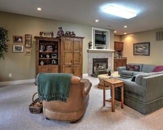 Two custom, hand made, wooden units (bookcase and media center), artificial tree, sectional sofa and small table.