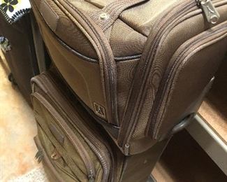 Two pieces of matching Travelpro luggage.