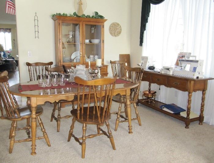 Maple table with 6 chairs and a leaf with a matching petite china cabinet