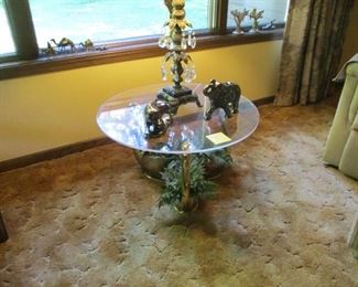 Brass swans, glass top table