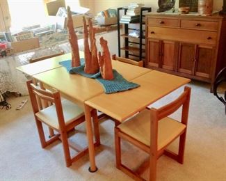 Oblong Dining Table with 4 Chairs.  The Leaf folds into the table.  Very Good Condition