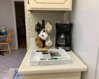 Mugs, coffee maker and utensils