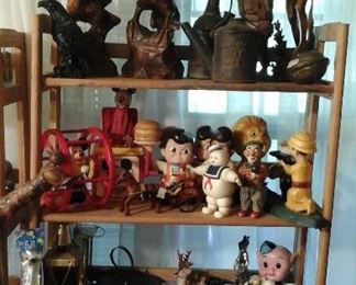 Wood carvings,  Railroad oil can, Brass nut cracker, vintage toys, Cast iron banks, liquor decanters, San and Streiffe binoculars, pool balls