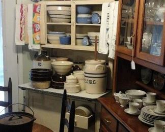 Hoosier style cabinet,  many crocks, Jugs and mixing bowls 