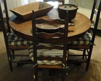 antique oak round pedestal table and four ladder back chairs, rectangular carved dough bowl, primitive hand carved bowl with odd shaped handle. 