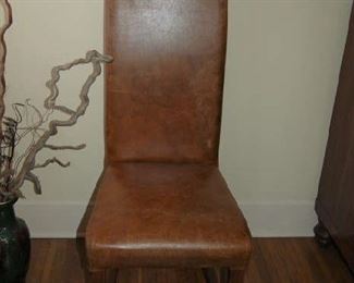 One of pair of leather chairs