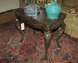 Tea table with hoofed legs