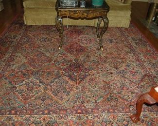 One of several antique and Karastan rugs