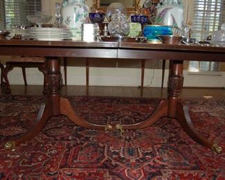 Double pedestal banded dining table