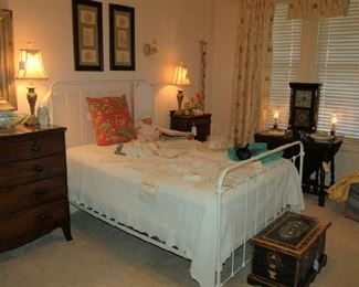 Iron bed and vintage linens