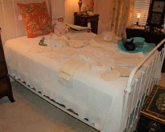 Iron bed and vintage linens