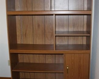 Entertainment center with lower right hinged door.