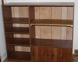 Another entertainment center with ample storage and display space and double doors.