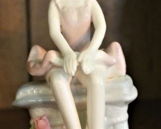 Porcelain ballerina figurine.