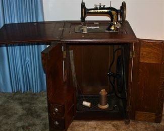 Antique New Home Treadle sewing machine with Parlor Cabinet