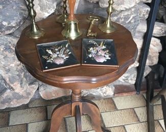 . . . a cute Duncan Pfyfe-style lamp table with brass feet.