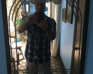 Ignore the goofy guy in phot -- a nice wall mirror -- one of several.