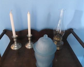 . . . a nice wash stand with pewter candlesticks, a hurricane lamp, and a nice frosted piece.