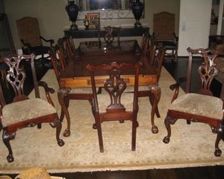 Henredon Chippendale dining table with 10 chairs and 2 2' leaves.  76" - 100" with 2 leaves. 