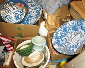 A large assortment of enamel ware, stoneware bowls, pottery, etc.