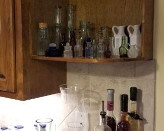 cool mini bottle collection - many are old, other kitchen glass