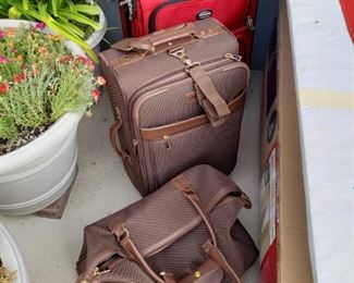 London Fog and other name brand luggage.