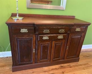 Antique English sideboard. Room for wine storage in center.