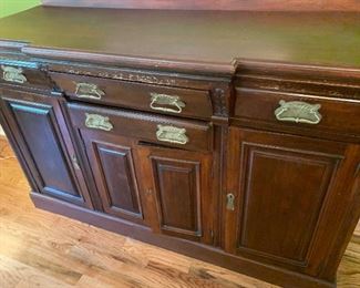 Antique English sideboard. Room for wine storage in center.