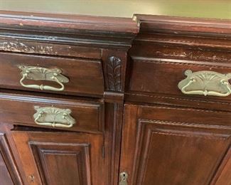 Antique English sideboard. Room for wine storage in center.