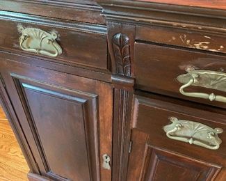 Antique English sideboard. Room for wine storage in center.