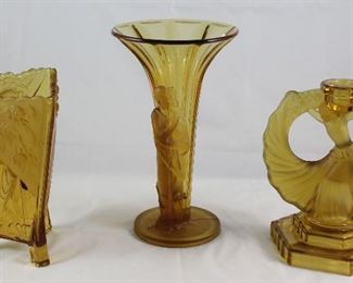 Walter & Sohne West Germany Rare Art Deco Amber Glass Collection: Triangle Footed Vase (7”H x5 1/4”W), Trumpet Style Vase (9.5”H x 5.5”W). Dancing Girl Candlestick (7,5”H x 6.5”)
