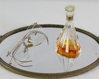 Hollywood Regency Mid Century Gold Plated Small (10.5” x 6”) Oval Vanity Mirror. Shown with Antique Wire Rim Eyeglasses and 1940’s Intoxication by D’orsay Perfume