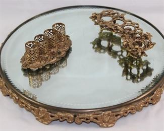 Antique Bevel Mirror Plateau Footed Tray Shown with Hollywood Regency Mid Century Gold Plated Filigree Lipstick Holdes
